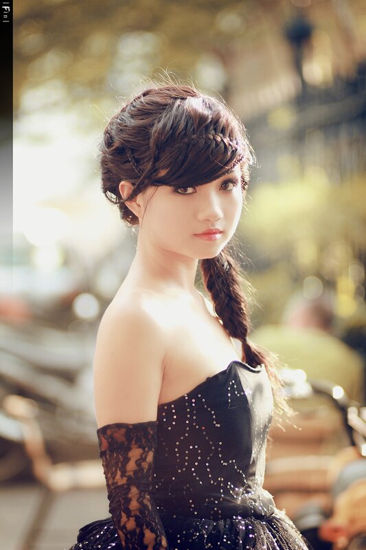 woman in black dress with braided hair