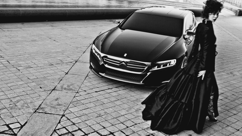 woman in black dress with car