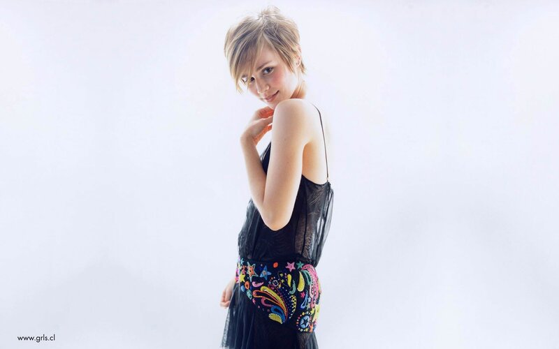 woman in black dress with colorful belt