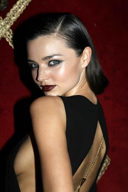 woman in black dress with dark makeup