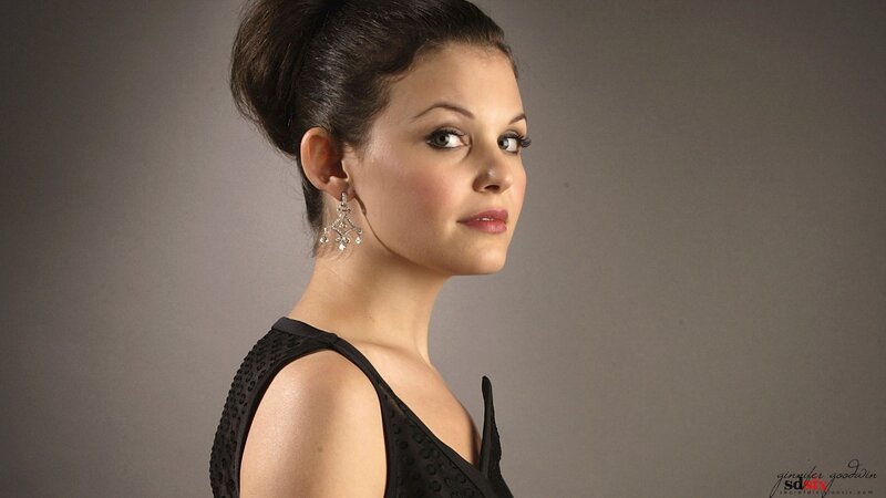 woman in black dress with earrings