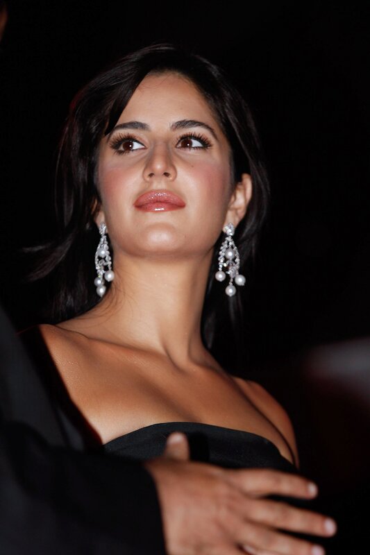 woman in black dress with earrings