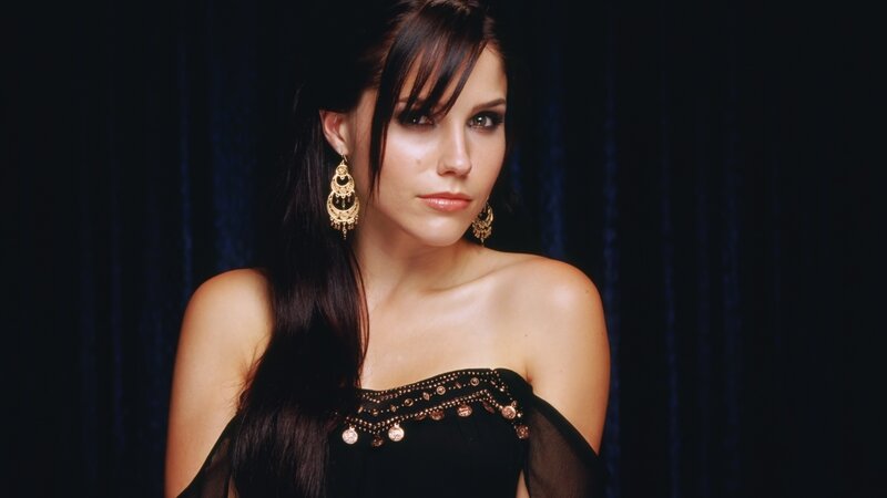 woman in black dress with earrings