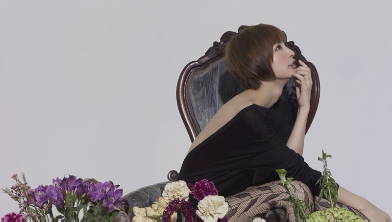 woman in black dress with flowers