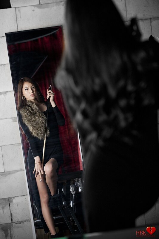 woman in black dress with fur stole