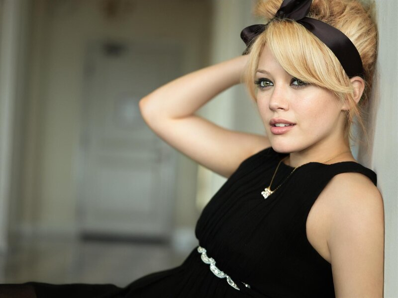 woman in black dress with headband