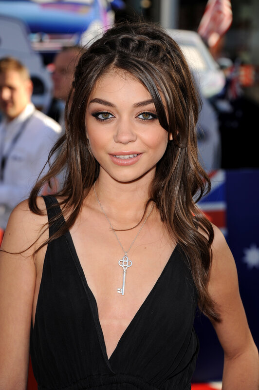 woman in black dress with key necklace