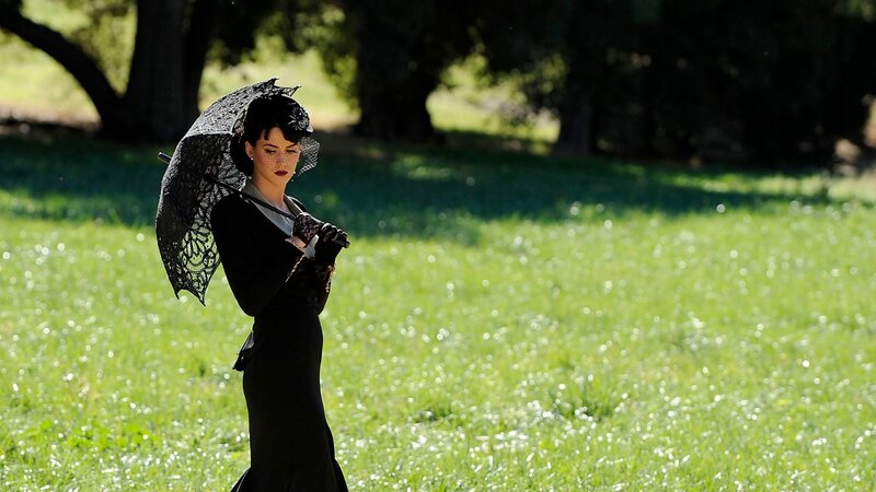 woman in black dress with lace umbrella