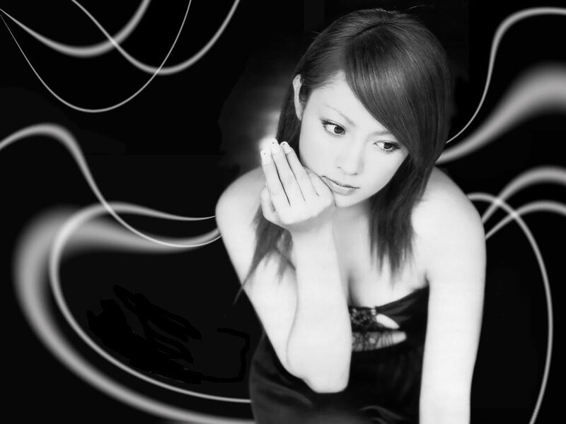woman in black dress with light swirls