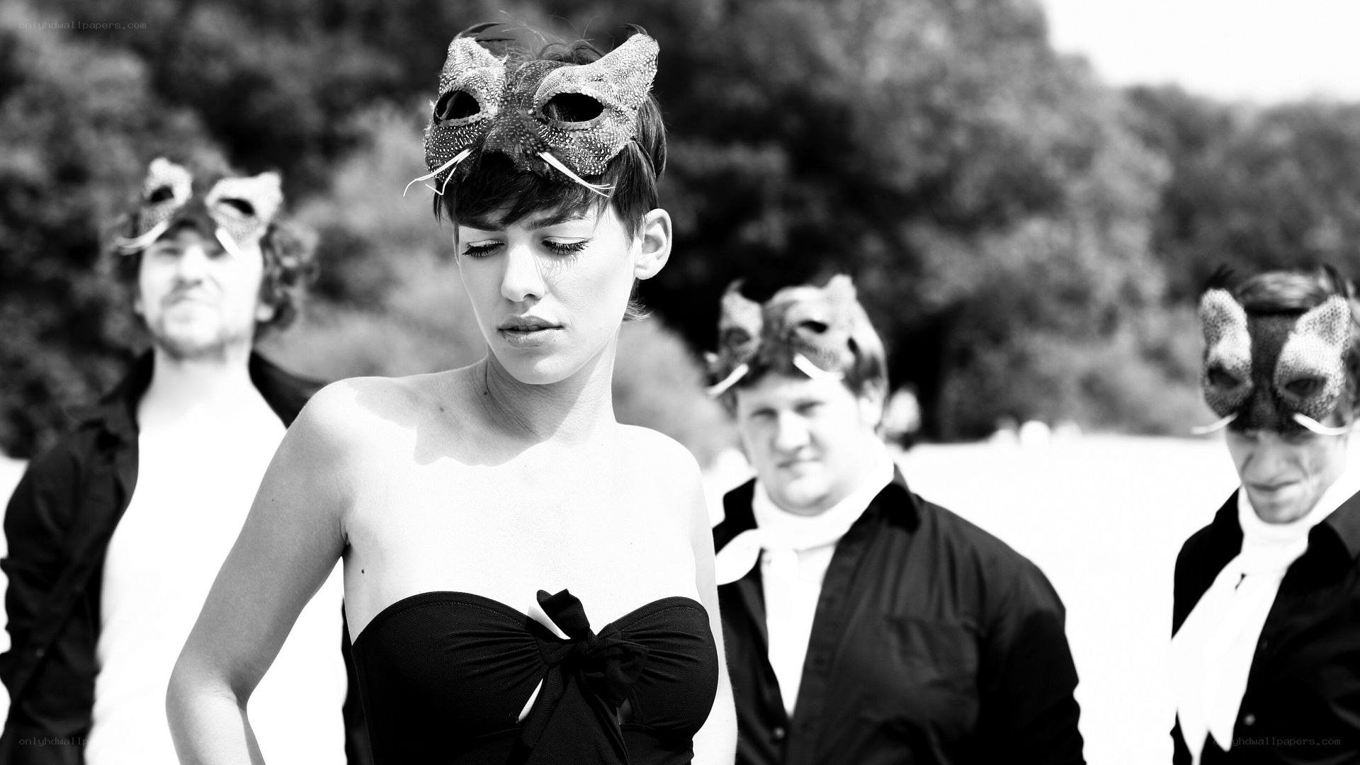 Woman in black dress with mask