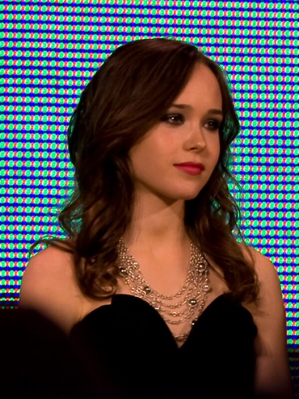 woman in black dress with necklace