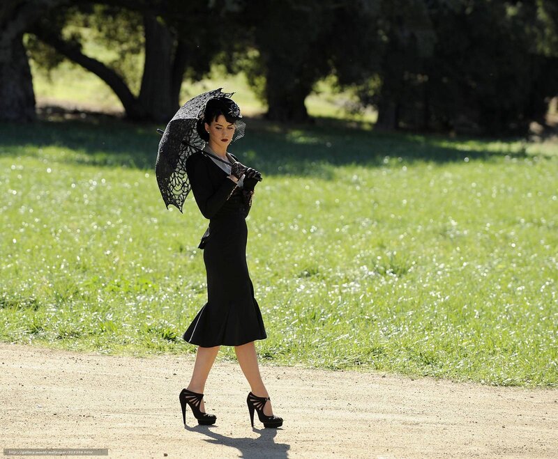 Woman in black dress with parasol