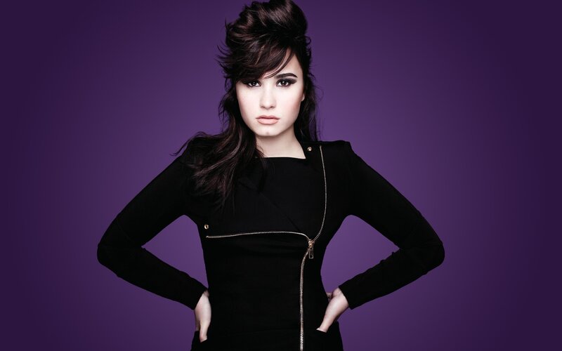 woman in black dress with purple background
