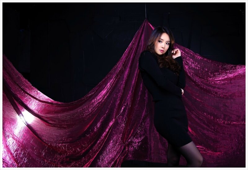 woman in black dress with purple fabric