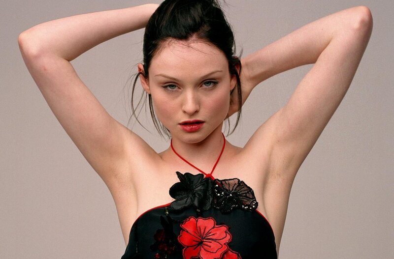 woman in black dress with red flowers