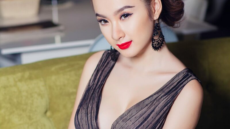 woman in black dress with red lipstick