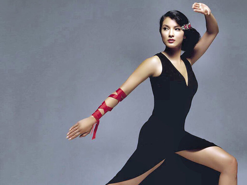 woman in black dress with red ribbons