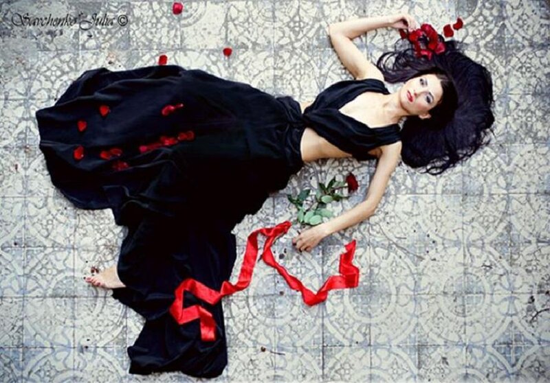 woman in black dress with roses