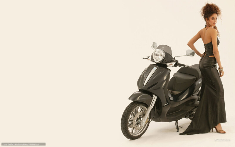 woman in black dress with scooter