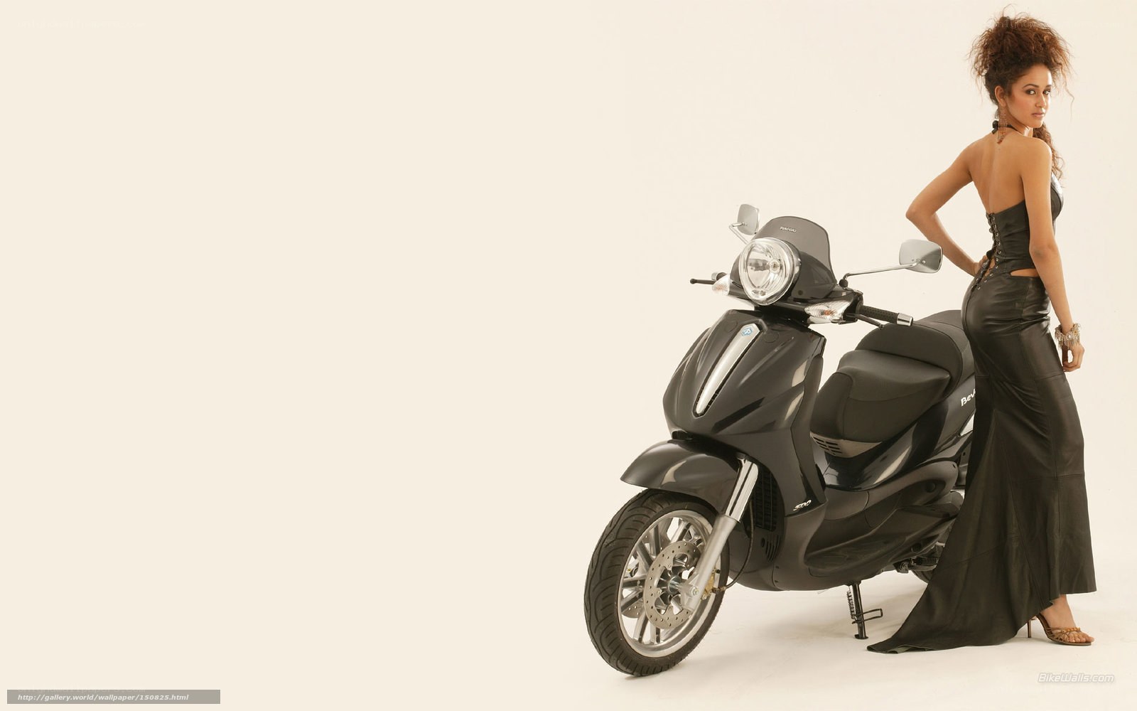 woman in black dress with scooter
