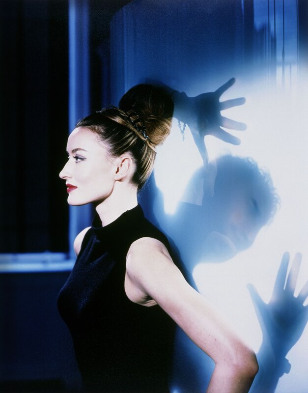 woman in black dress with shadow
