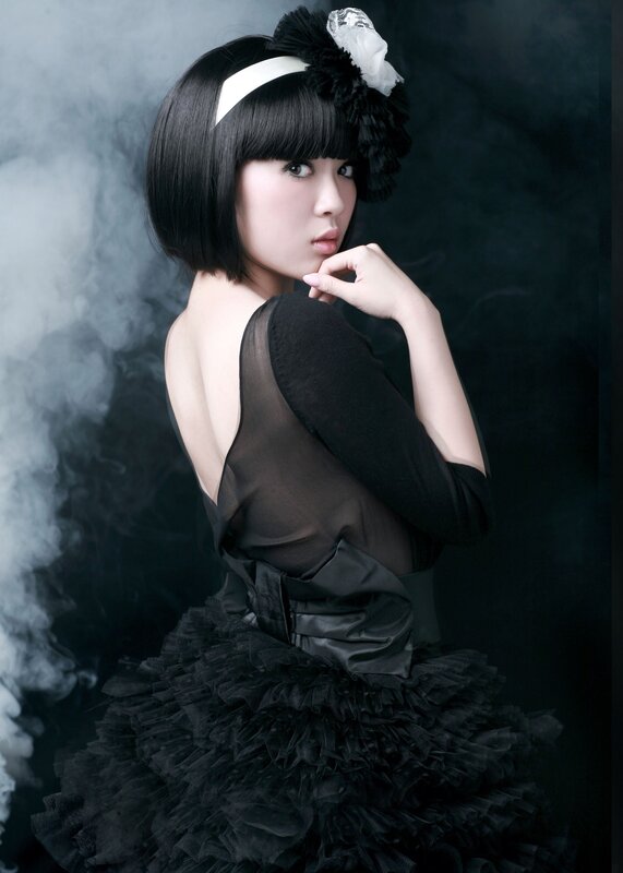 woman in black dress with smoke
