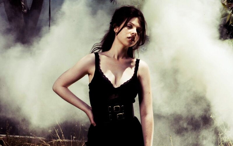 woman in black dress with smoke