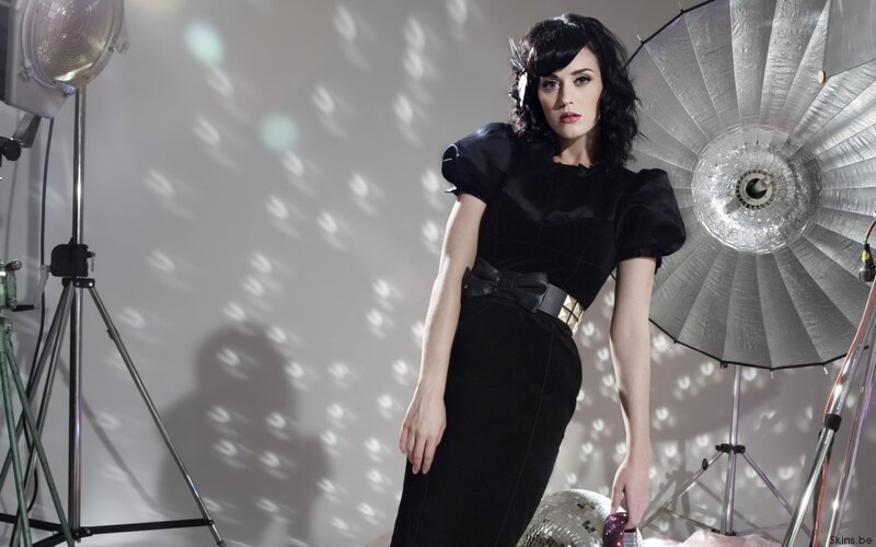 woman in black dress with studio lights