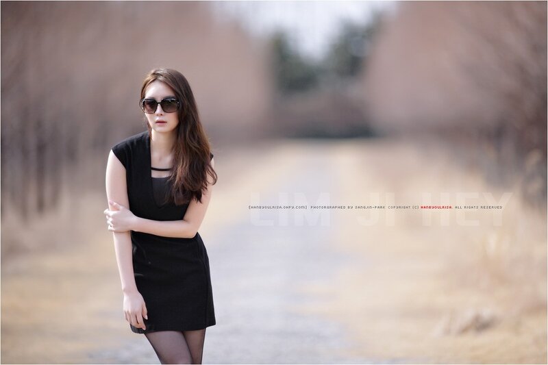 woman in black dress with sunglasses