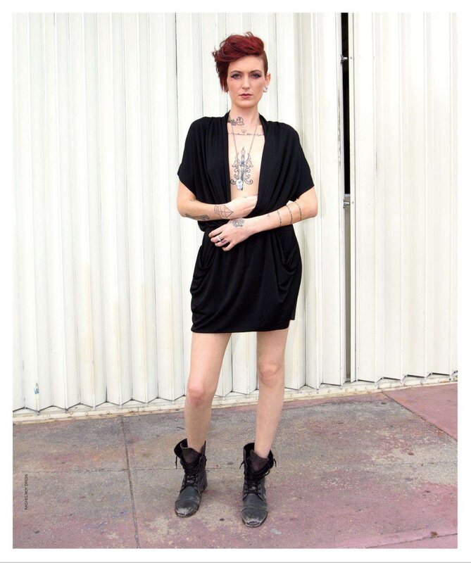 woman in black dress with tattoos