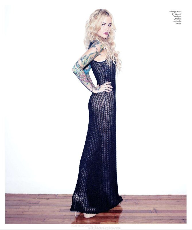 Woman in black dress with tattoos