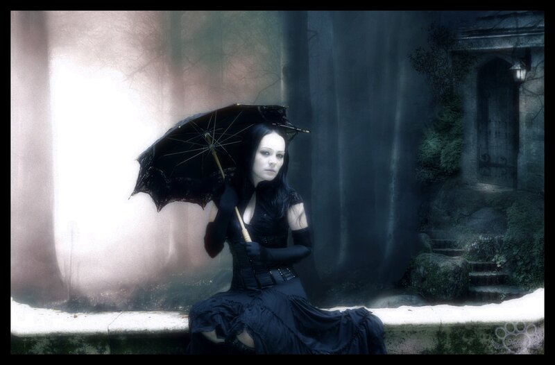 Woman in black dress with umbrella