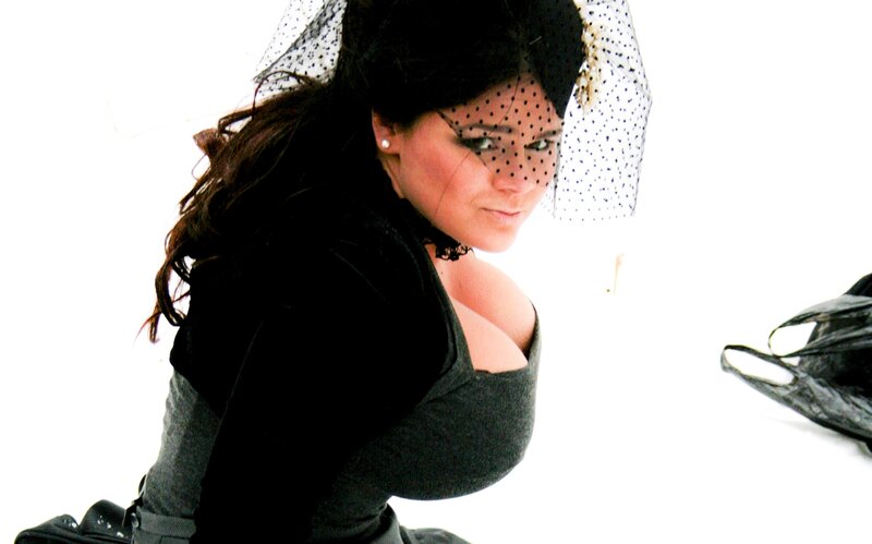 woman in black dress with veil