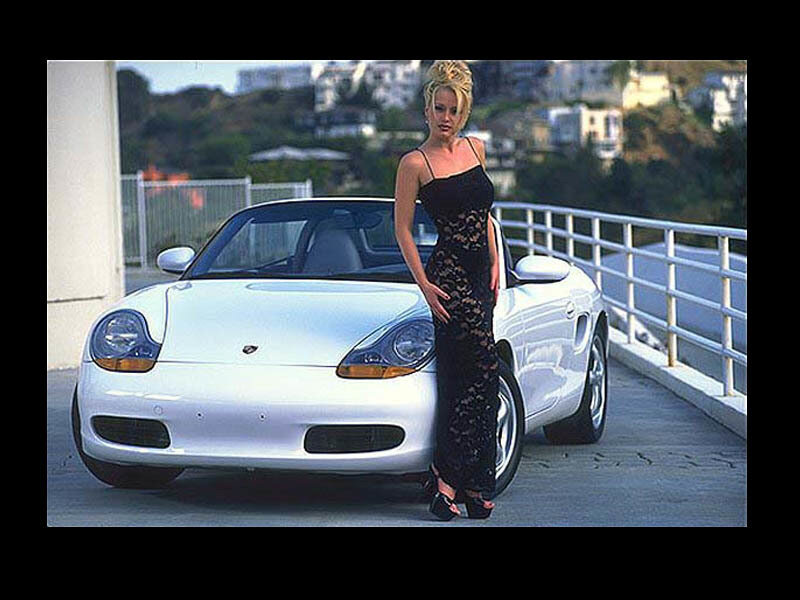 woman in black dress with white car