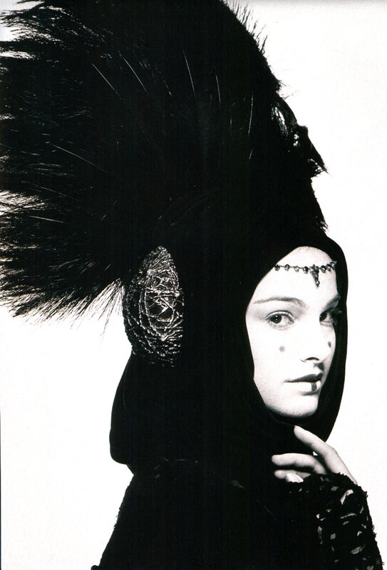 woman in black feathered headdress
