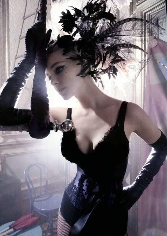 woman in black feathered headpiece