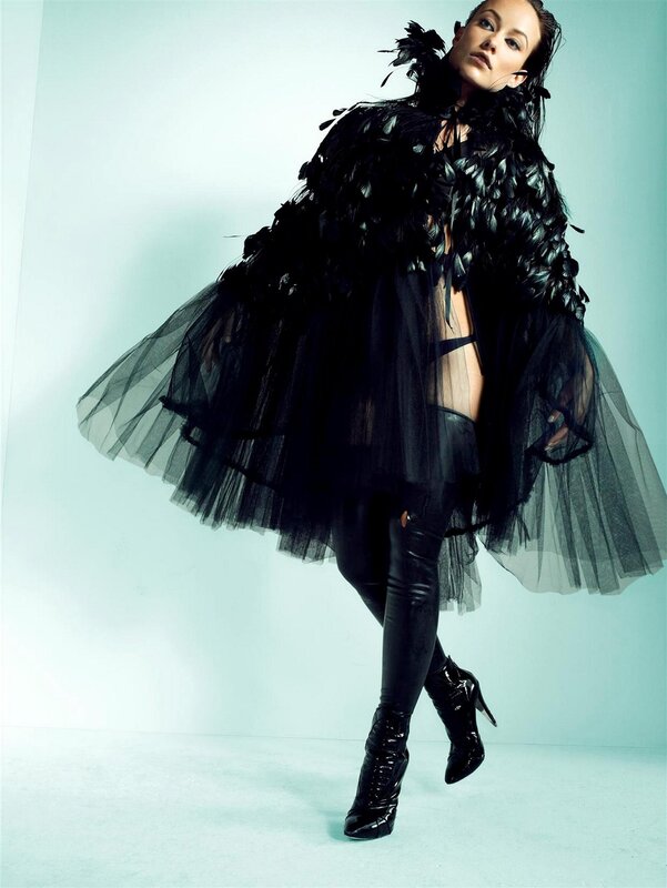 woman in black feathered outfit