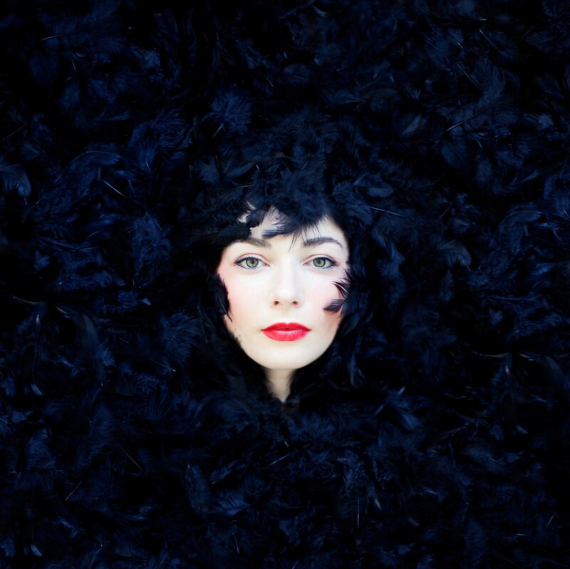 Woman in Black Feathers — Dramatic