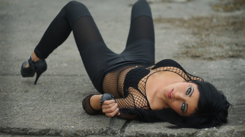 woman in black fishnet outfit