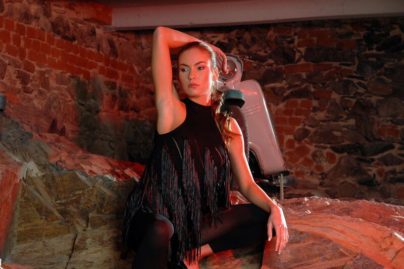 woman in black fringed top