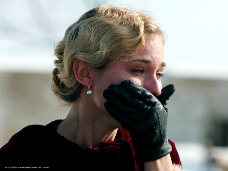 woman in black gloves crying