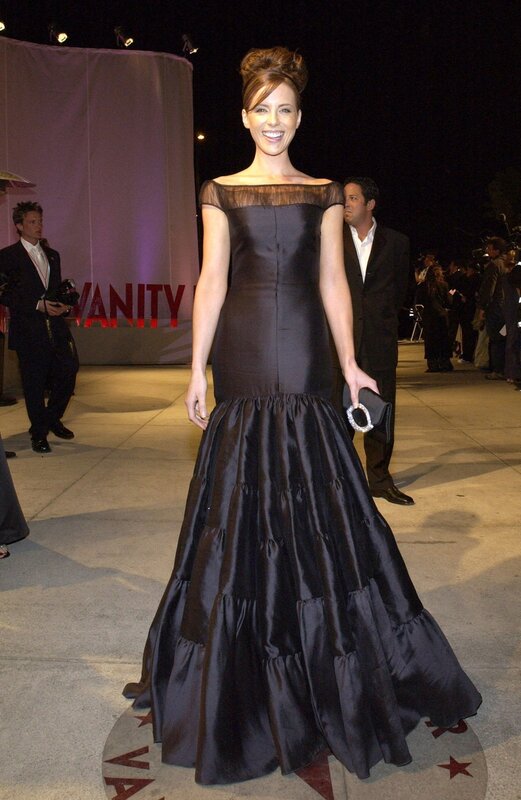 Woman in black gown at event