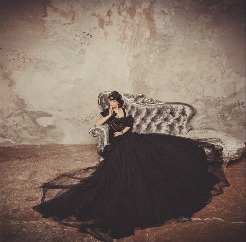 Woman in Black Gown — Dramatic, Photograph, Couch