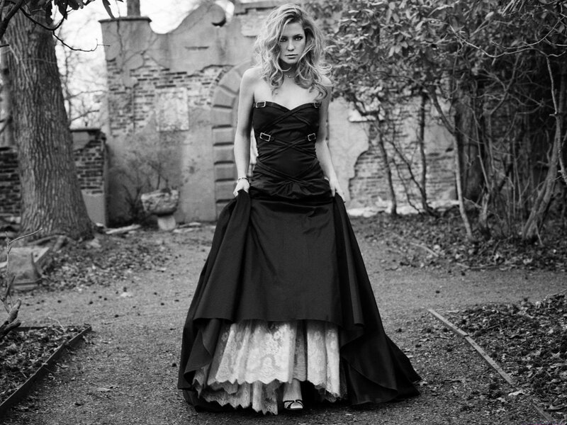 Woman in black gown outdoors