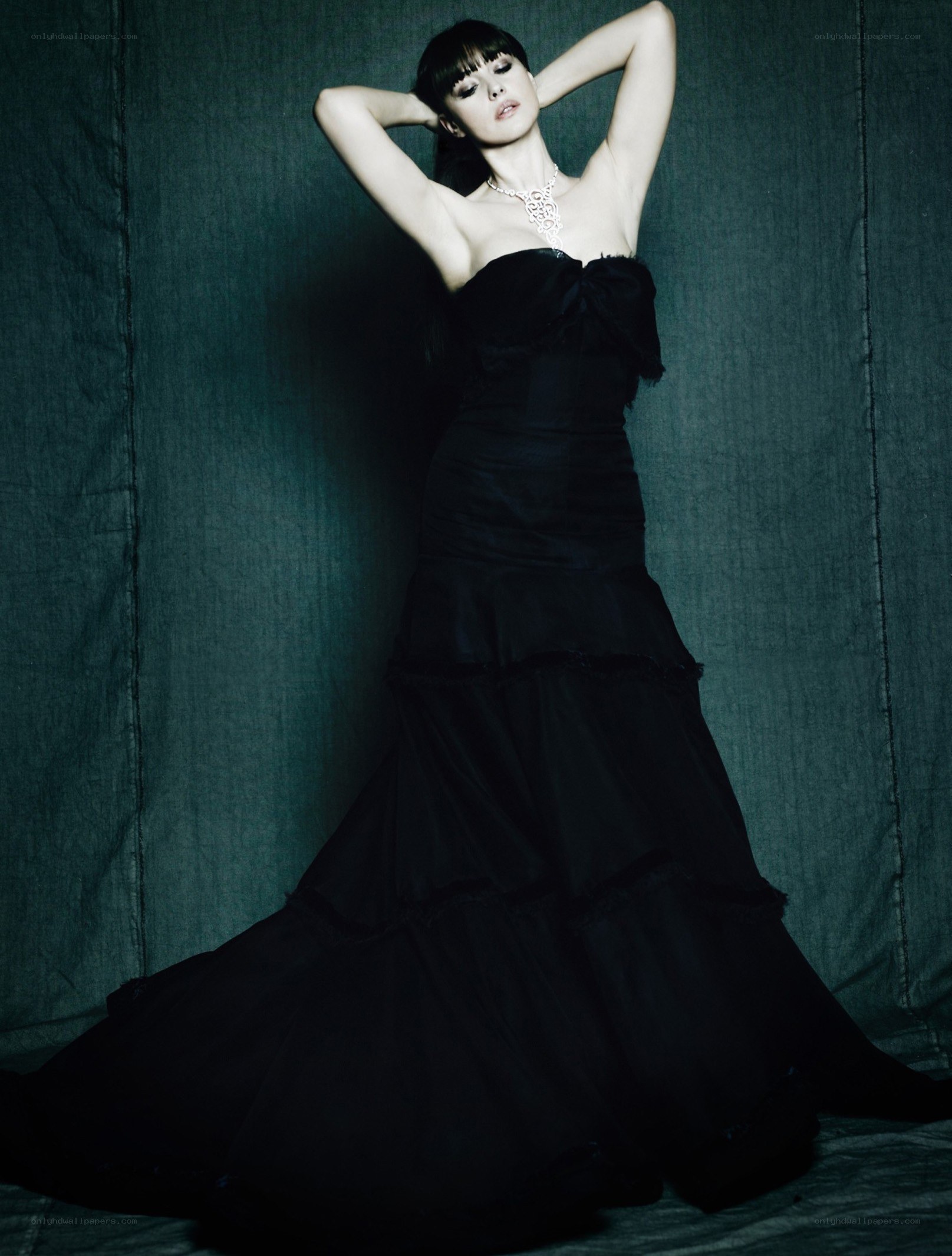 woman in black gown posing
