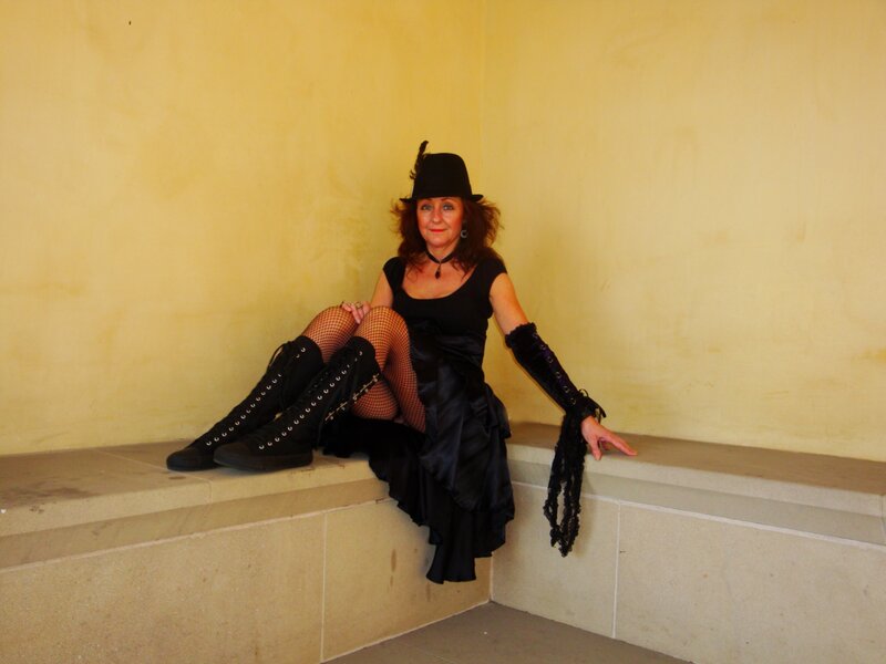 Woman in black hat and boots
