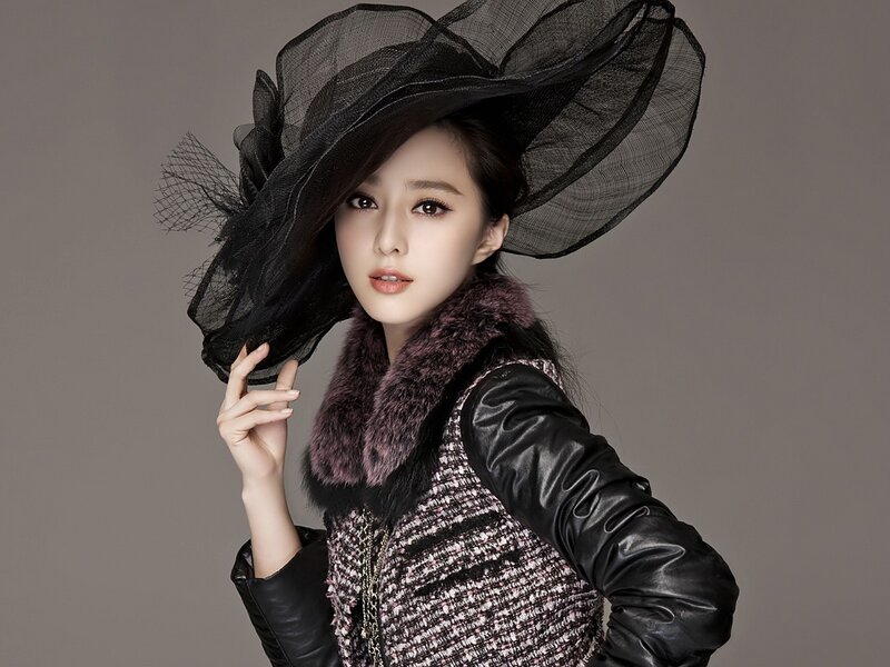 woman in black hat and coat