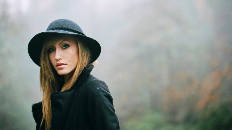 woman in black hat and coat