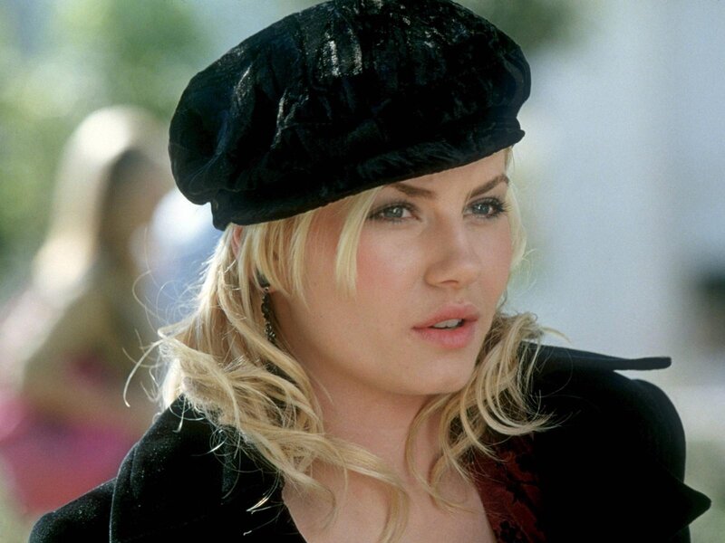 woman in black hat and coat