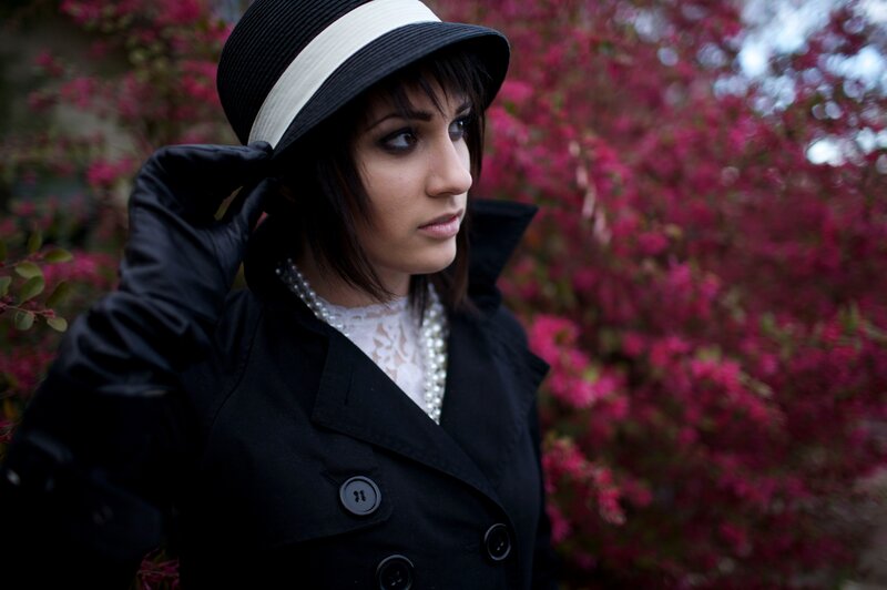 woman in black hat and coat